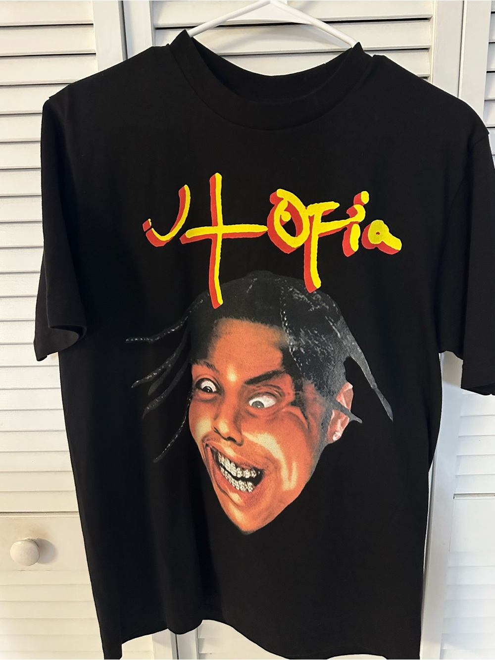 Black Short-Sleeve Graphic Tee with Yellow-Red Script